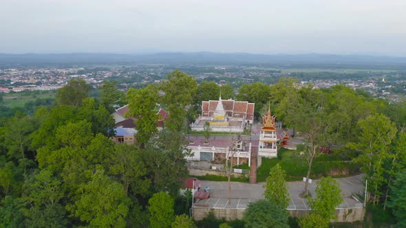 Aerial view of golden buddha pagoda stupa. Wat Phrathat Khao Noi Temple Park, Nan alt
