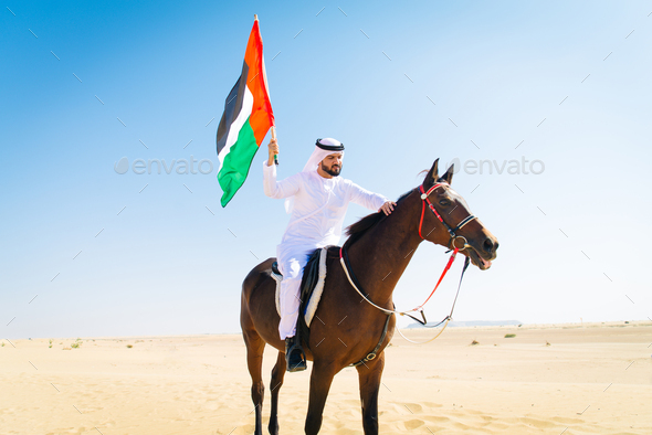 Arabian man with horse in the desert