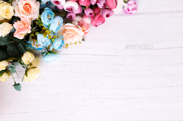 Backdrop of colorful artificial flowers background in a wedding reception  with soft colors. Stock Photo by Sepaolina