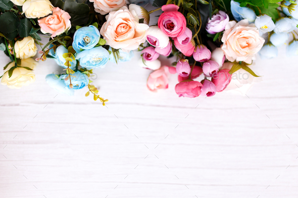 Backdrop of colorful artificial flowers background in a wedding reception  with soft colors. Stock Photo by Sepaolina