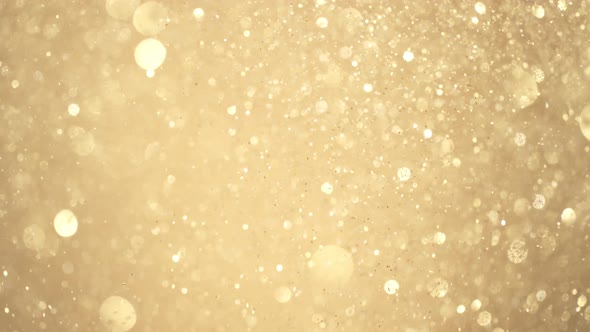 Golden Glitter Background in Super Slow Motion at 1000Fps alt