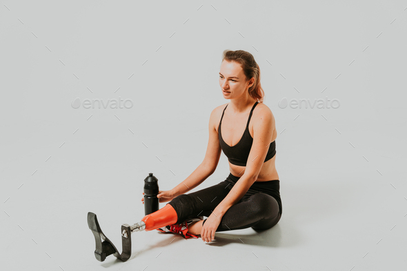 Beautiful woman with prosthesis leg Stock Photo by oneinchpunchphotos