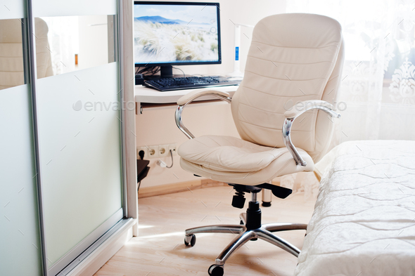White leather luxury office chair background monitor of computer at light  room. Stock Photo by ASphotostudio