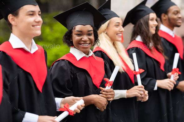 Happy black lady smiling at camera while having graduation ceremony