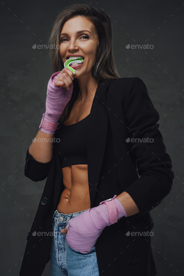 A sexy young and fit female fighter posing in combat poses, Stock Photo,  Picture And Low Budget Royalty Free Image. Pic. ESY-005985199 | agefotostock