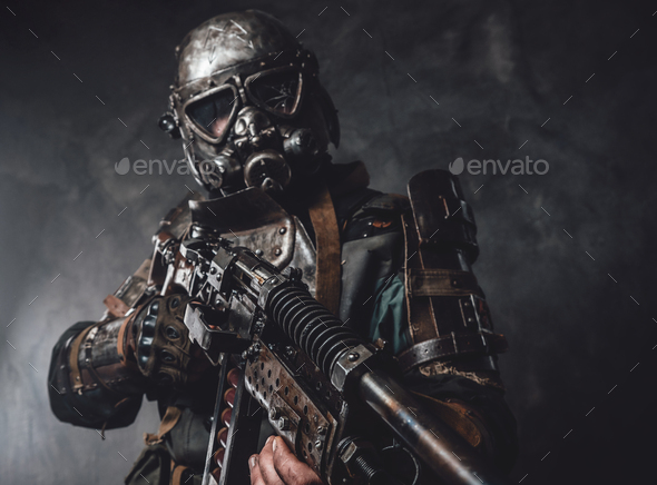 Stalker with custom armour and gun poses in dark background Stock Photo ...