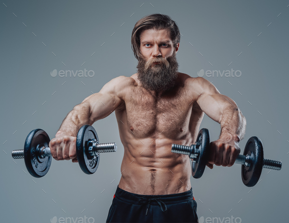 Strong Bodybuilder With Dumbells And Naked Torso Posing In Studio Stock Photo By Fxquadro