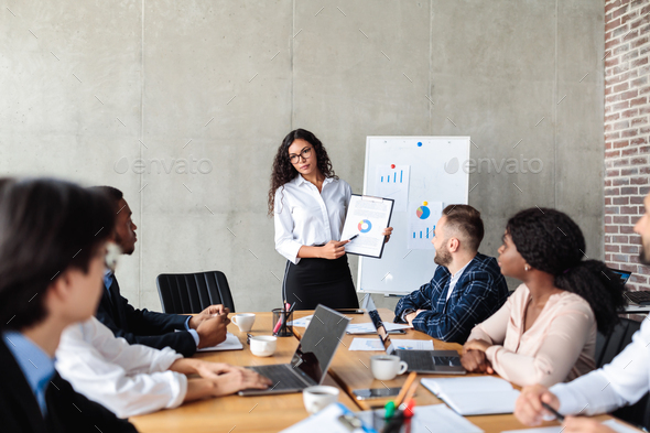 Female Marketing Specialist Making Business Presentation For Coworkers ...