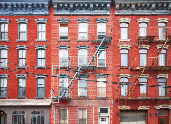 New York townhouses with fire escapes.