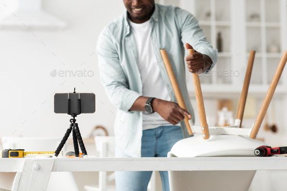 New hobby. Black man shooting video blog about repair and joinery