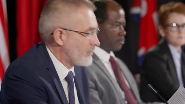 Diplomat Reading Statement at Press Conference alt