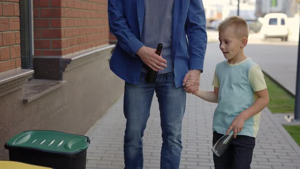 Dad Teaches His Son to Properly Sort Garbage alt