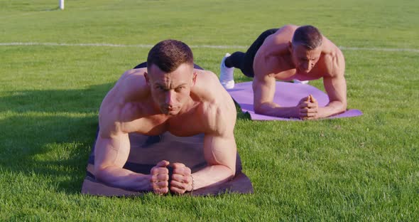 Sporty Shirtless Guys Doing Exercises for Abs on Fresh Air alt