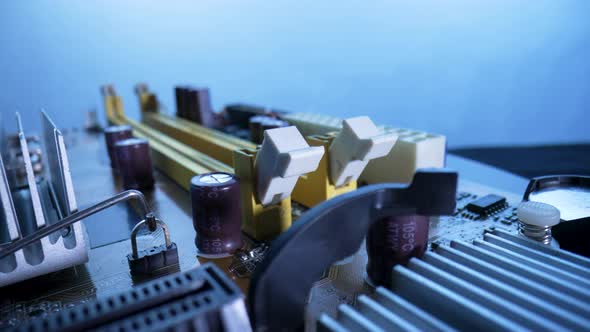 Computer Motherboard Microcircuit with Chips Memory Slots Aluminum Heatsinks for Cooling Transistors alt