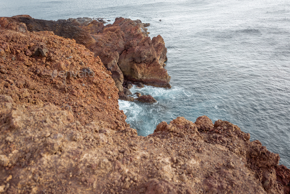 Rocky ocean coast with steep precipice - Stock Photo - Images