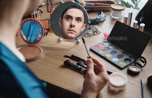 Gender applying makeup - Stock Photo - Images
