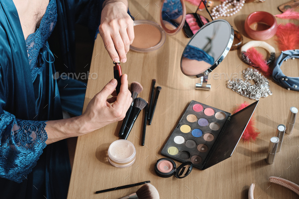 Man using cosmetics for makeup