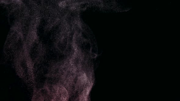 Golden shiny particles floating on a black background alt