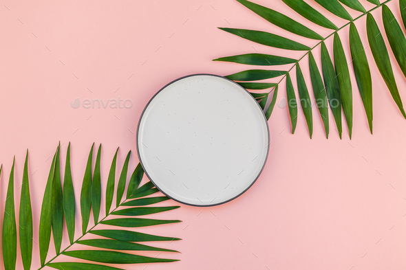 Download Empty Plate Mockup With Green Tropical Leaves Stock Photo By Nzooo