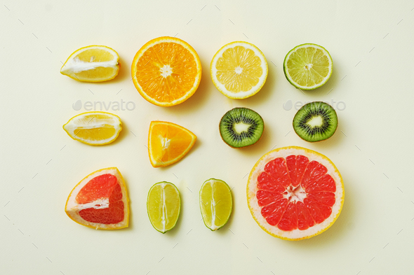 Lemon, orange, lime and grapefruit cut into pieces - Stock Photo - Images