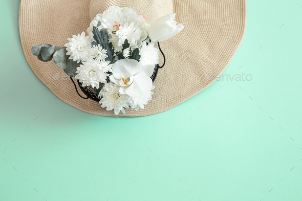 Summer background with flowers and a hat. Stock Photo by puhimec