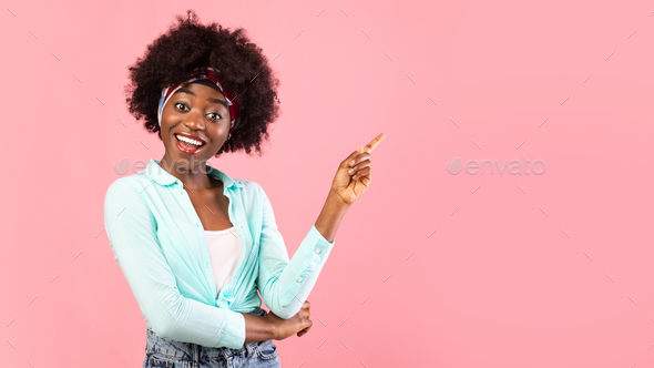 Black Woman Pointing Finger Aside Standing Over Pink Background, Panorama