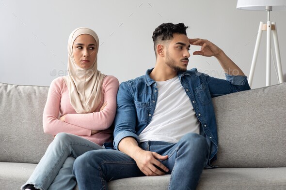 Upset middle-eastern husband and wife having quarrel at home