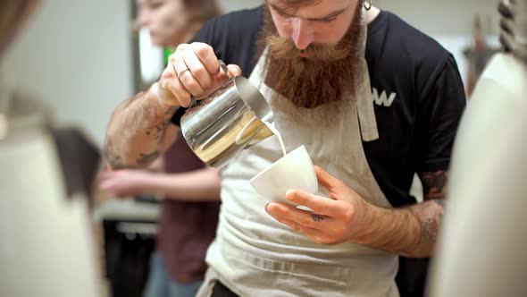 Barista Making Coffee in Coffeeshop