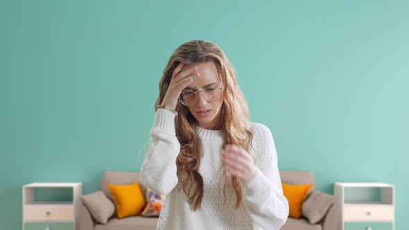 Young Beautiful Woman Suffering From Headache Desperate and Stressed Because Pain and Migraine. The alt