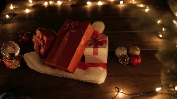 Christmas Presents On Santa Hat With Lights alt