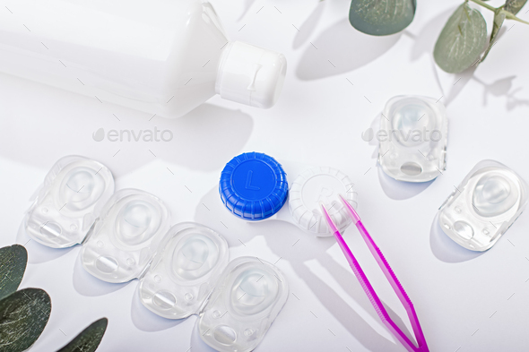 Contact lenses kit with on white, top view Photo by Beo88