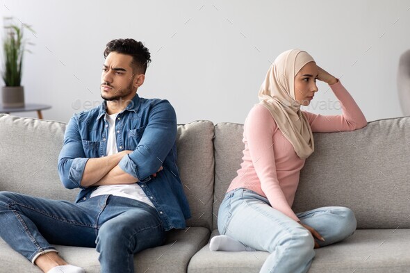Angry muslim husband and wife having quarrel at home