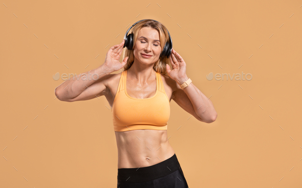 Enjoy music at exercising at home alone during COVID-19 pandemic - Stock Photo - Images