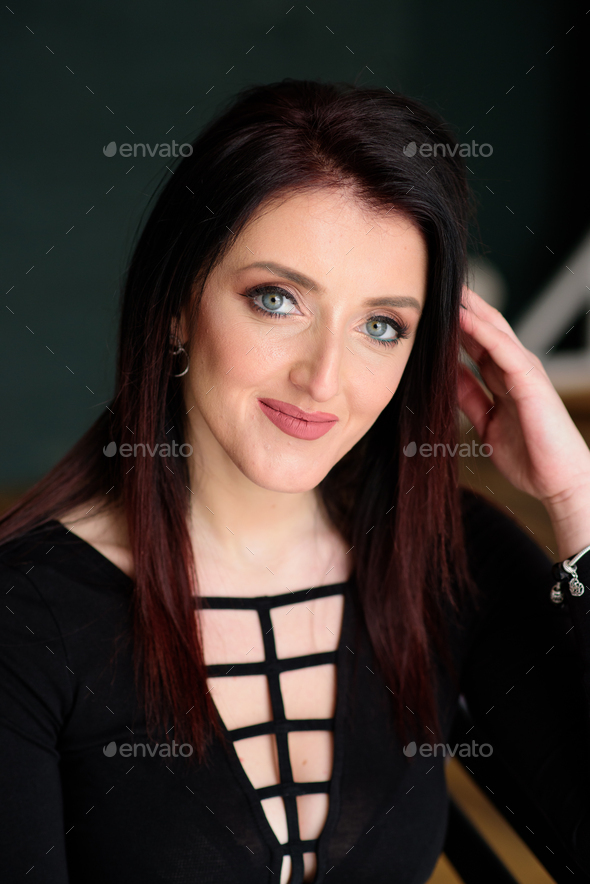 Smiling attractive young woman with sexy shapely forms, Stock Photo by  wolfhound9111