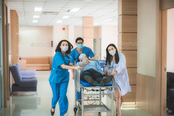 Emergency Department: Doctors and Nurses moving Seriously Injured Unconcious Patient