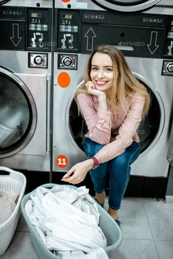 Woman in the laundry Stock Photo by RossHelen | PhotoDune