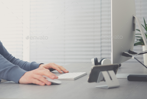 Men Behind Office Desk Working on His Desktop Computer - Stock Photo - Images