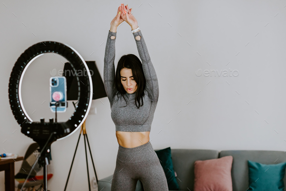 Fitness workout exercises online woman at home. Online fitness course Stock  Photo by avanti_photo