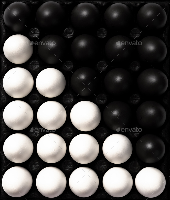 Black and White Eggs. Cultural Diversity Concept Image. Flat Lay Abstract Pattern