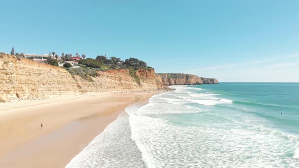 Porto De Mós sandy beach enclosed by Turquoise sea and golden Cliffs, Lagos, Algarve, Portugal alt