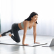 Fit sporty young asian woman online workout exercise at home. Active  healthy girl enjoy sport pilates yoga fitness training on laptop computer  stretching on yoga mat watching video class 8570353 Stock Photo