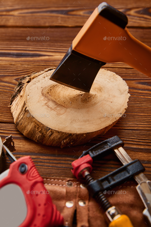 Axe on stump, measuring tape and vise, instrument - Stock Photo - Images