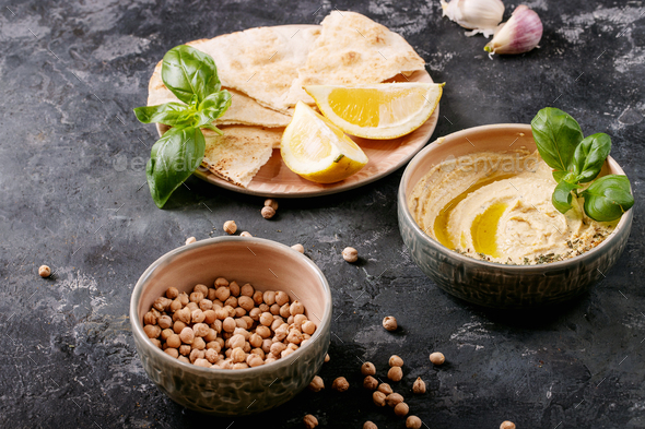 Hummus with olive oil and ground cumin - Stock Photo - Images