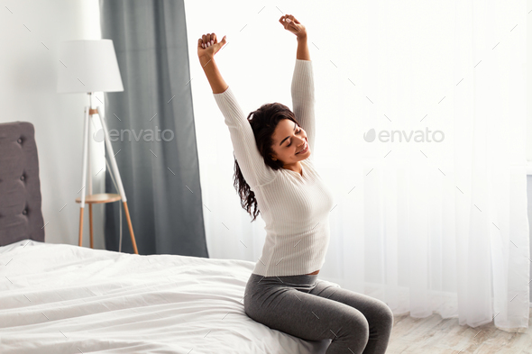 woman stretching with arms overhead. foto de Stock