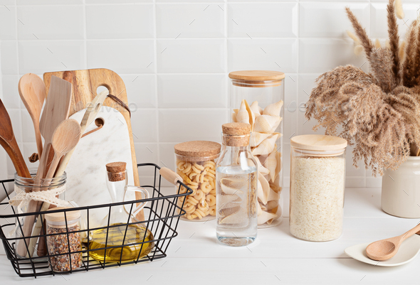 Organizing zero waste storage in kitchen. Pasta and cereals in reusable  glass containers in kitchen Stock Photo by OksaLy