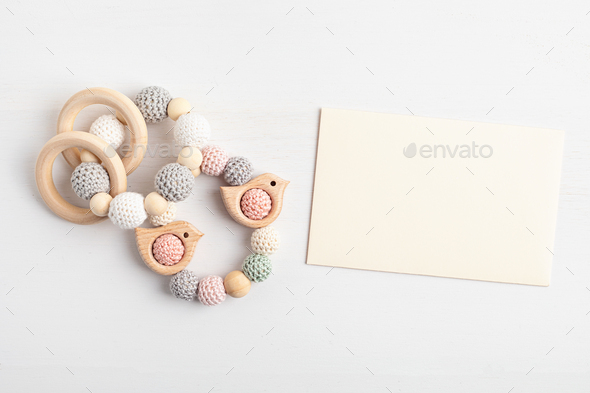 Download Eco Friendly Organic Newborn Teethers And Empty Card Mockup Template For Baby Shower Invitation Stock Photo By Oksaly