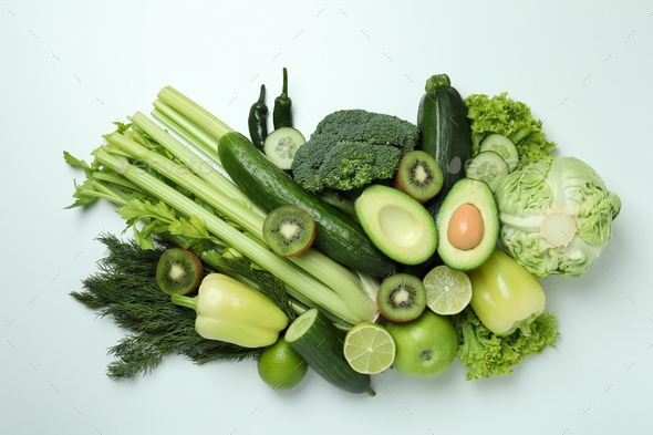 Fresh green vegetables on white background, top view Stock Photo by  AtlasComposer