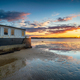 Sunset over an old boat on Bramble Bush Bay at Studland in Poole Harbour - PhotoDune Item for Sale