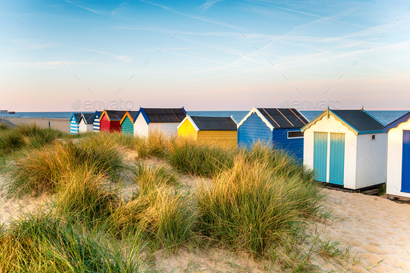 Pretty beach huts in the sand dunes - Stock Photo - Images