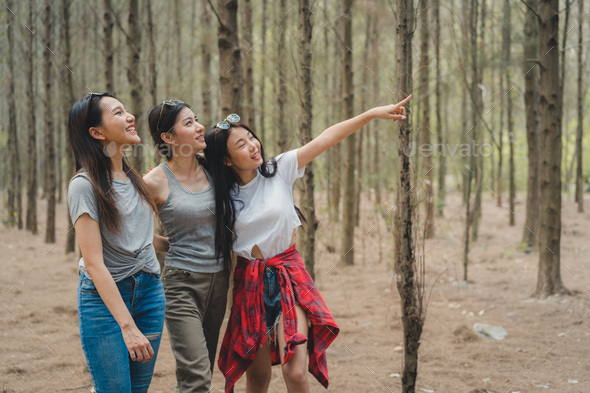 Hiker Asian backpacker woman on hiking adventure walking in forest